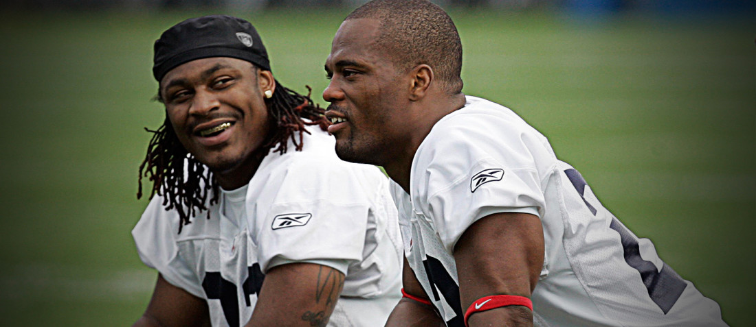 Marshawn Lynch and Fred Jackson stretch during practice