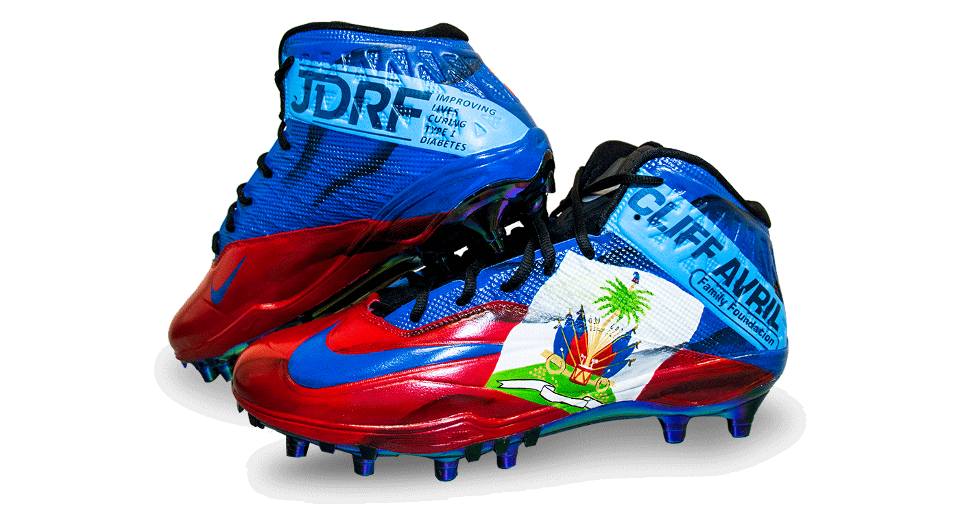 Avril's right red and blue cleat stacked on top of his left cleat