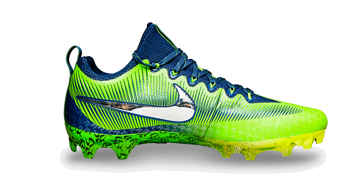 Right view of Sherman's blue and green cleat with reflective Nike swoosh
