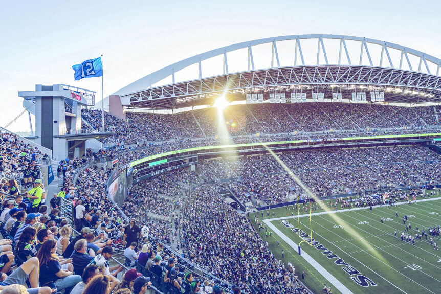 2 Seahawks fans talk while watching the game