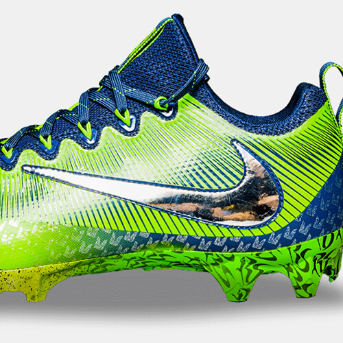 Richard Sherman's green and blue cleat, viewed from the side